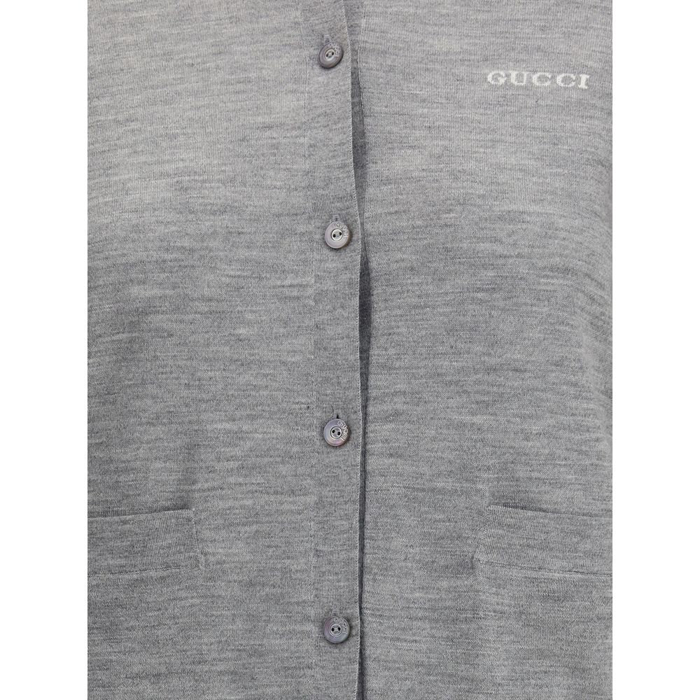 Gucci Gray Cashmere Cardigan with ribbed crew neck, button closure, patch pockets, stitched signature, made of cashmere and wool blend.