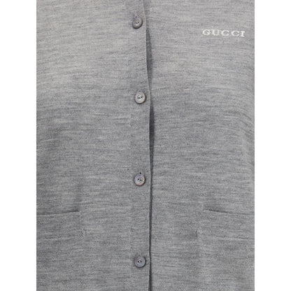 Gucci Gray Cashmere Cardigan with ribbed crew neck, button closure, patch pockets, stitched signature, made of cashmere and wool blend.