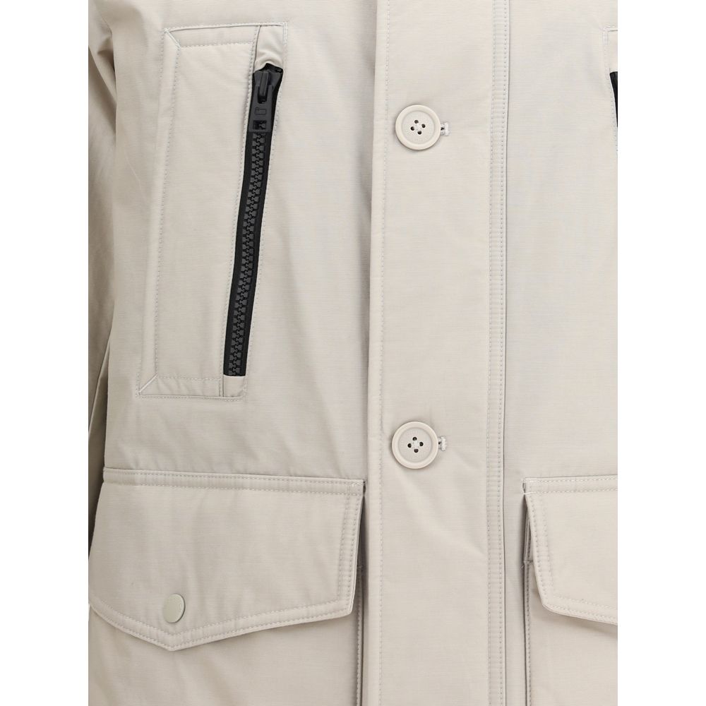 Close-up of Woolrich Beige Cotton Parka with front zipper, buttons, and pockets, highlighting the high-necked design and seasonal style.