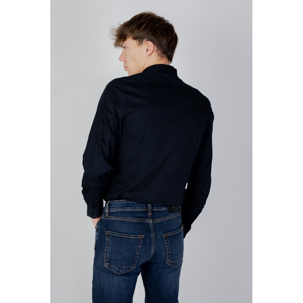 Back view of man wearing Antony Morato Blue Cotton Shirt and jeans, showcasing slim fit and contemporary style.