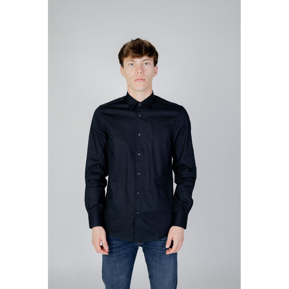 Model wearing Antony Morato Blue Cotton Shirt, long sleeves with classic cuffs, showcasing slim fit style for formal and casual occasions.