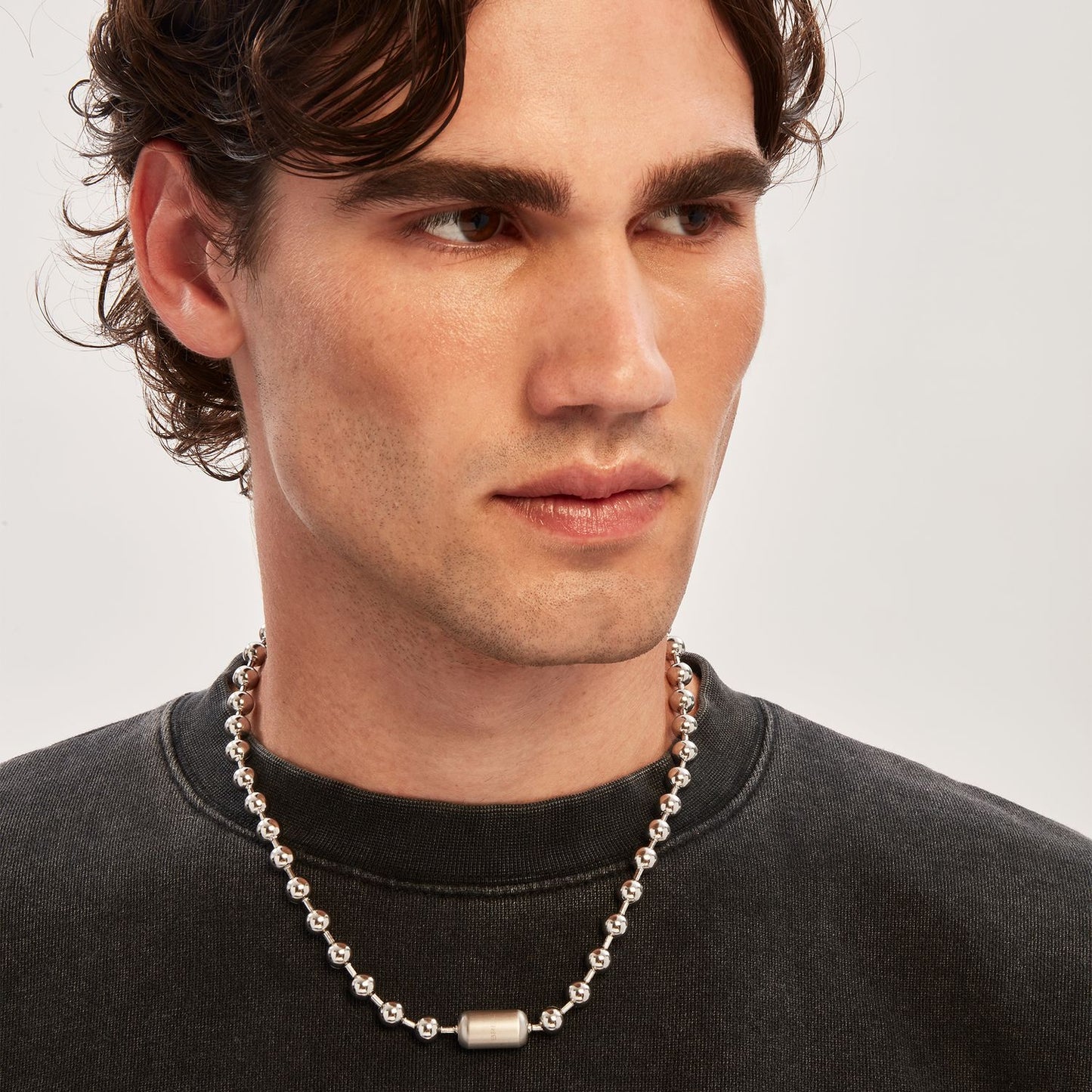 Gent wearing BREIL JEWELS Mod. TJ3668 silver necklace, quartz analog, with chronograph functions, water resistant up to 5 ATM.