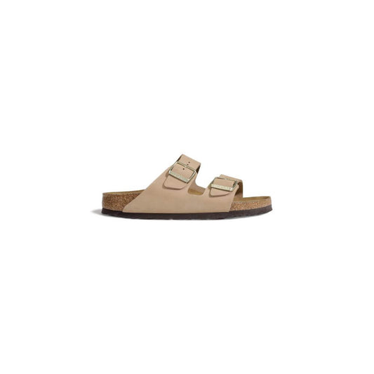 Birkenstock Beige Nubuc Leather Sandal with adjustable straps and cork footbed, side view.