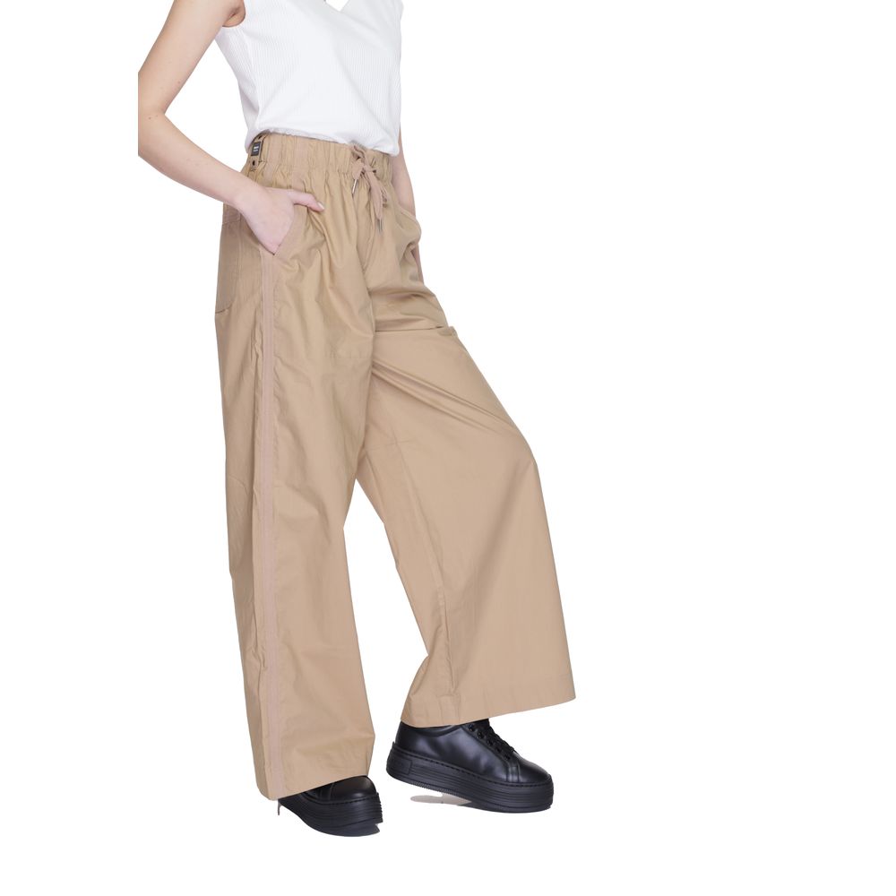 Model wearing Blauer Beige Cotton Casual Pants with wide legs and side pockets.