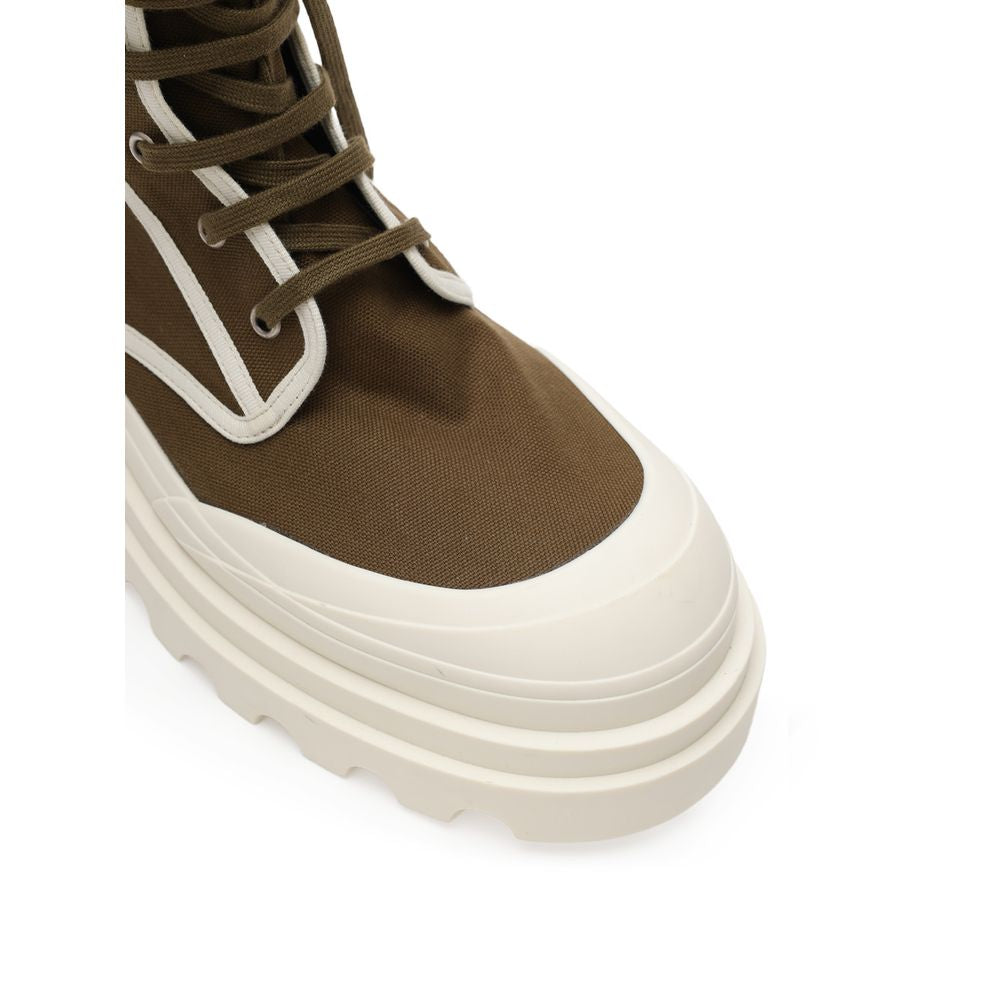 Close-up of Bottega Veneta Green Cotton Lace-Up Boots showcasing khaki canvas, white outsole, and tone-on-tone laces.