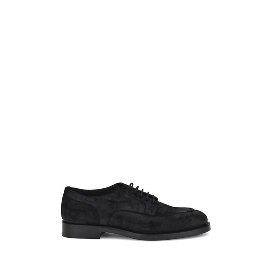 Elegant Brunello Cucinelli black suede lace-up shoes with flat sole and round toe, showcasing refined craftsmanship for everyday style.