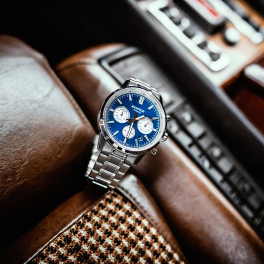 CASIO EDIFICE WATCHES Mod. EFR-575D-2AEF with stainless steel case and bracelet, featuring a blue chronograph dial on car seat.