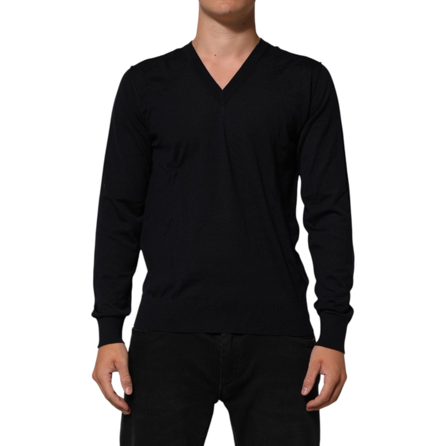Dolce & Gabbana Black Cashmere Knit V-Neck Pullover Sweater on model, showcasing luxurious fabric and sophisticated V-neck design.