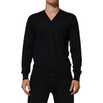 Man wearing Dolce & Gabbana Black Cashmere Knit V-Neck Pullover Sweater for a stylish and elegant look.