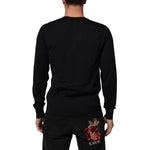 Rear view of model wearing Dolce & Gabbana Black Cashmere Knit V-Neck Pullover Sweater highlighting soft cashmere and ribbed trims.