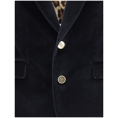 Dolce & Gabbana Black Cotton Blazer with gold button closure and leopard lining, featuring elegant velvet fabric and classic silhouette.