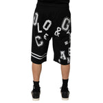 Back view of Dolce & Gabbana Black Logo Print Cotton Casual Bermuda Short on model, showcasing stylish logo and regular fit.