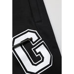 Close-up of Dolce & Gabbana Black Logo Print Cotton Casual Bermuda Short with white logo and drawstring detail.