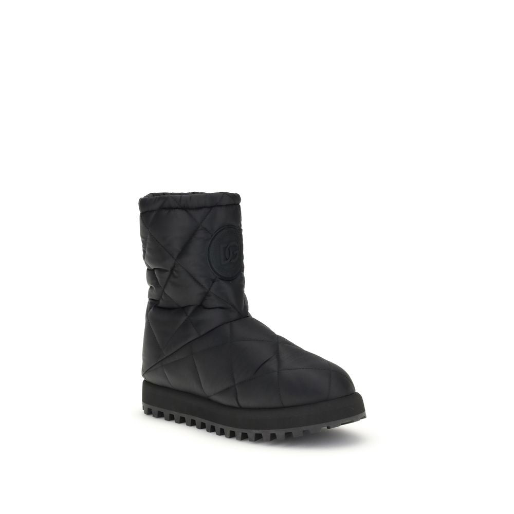 Dolce & Gabbana Black Polyamide Flat Boots with quilted diamond pattern, round toe, sturdy rubber lug sole, and logo patch detail.