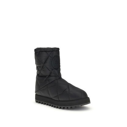 Dolce & Gabbana Black Polyamide Flat Boots with quilted diamond pattern, round toe, sturdy rubber lug sole, and logo patch detail.