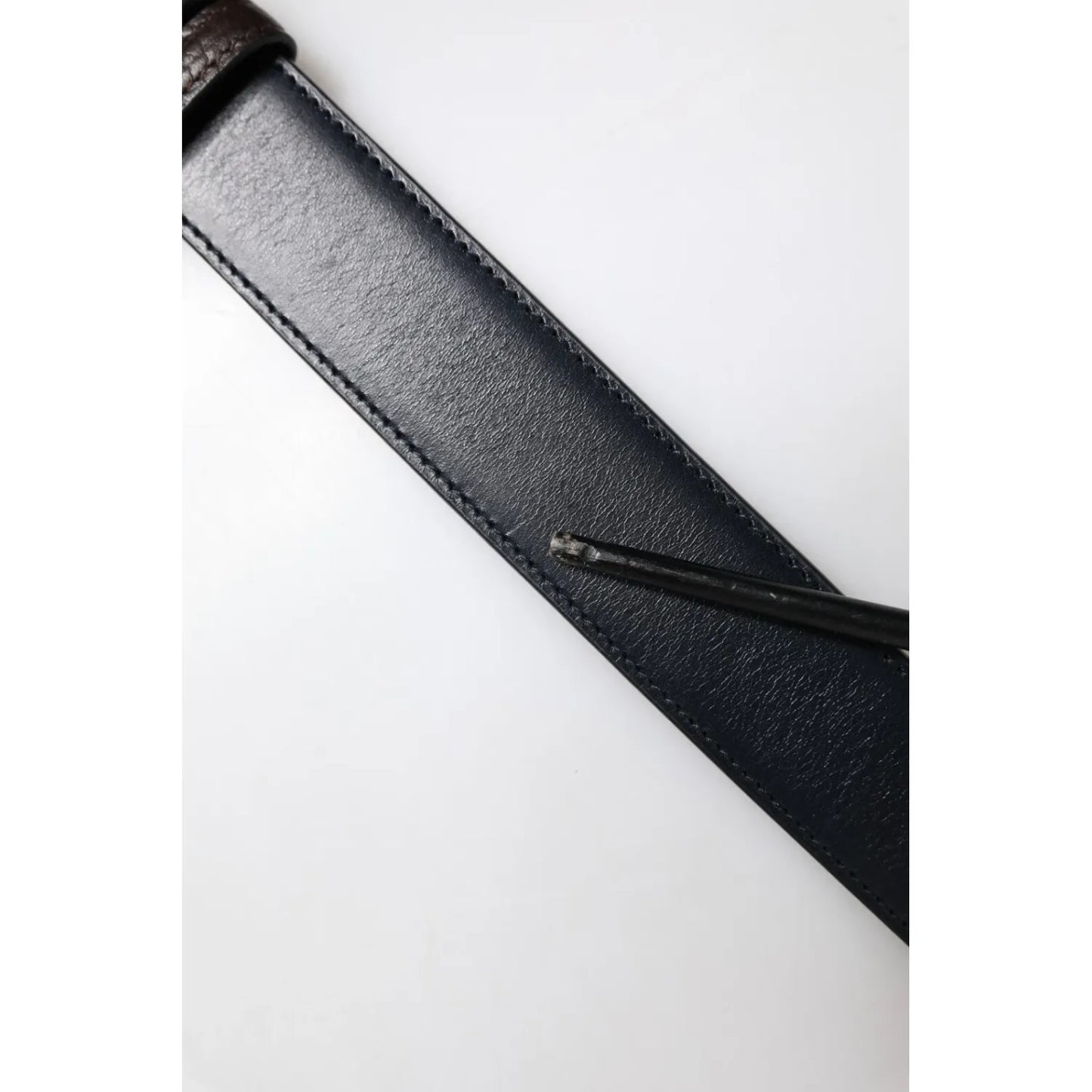 Close-up of Dolce & Gabbana Blue Brown Leather Buckle Reversible Belt showing high-quality leather texture and craftsmanship.