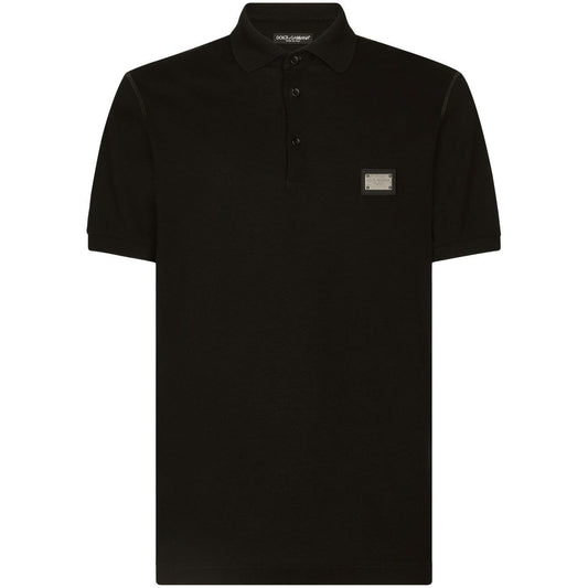 Dolce & Gabbana Logo cotton polo shirt in black, featuring a silver-tone logo plaque, polo collar, and front button placket.