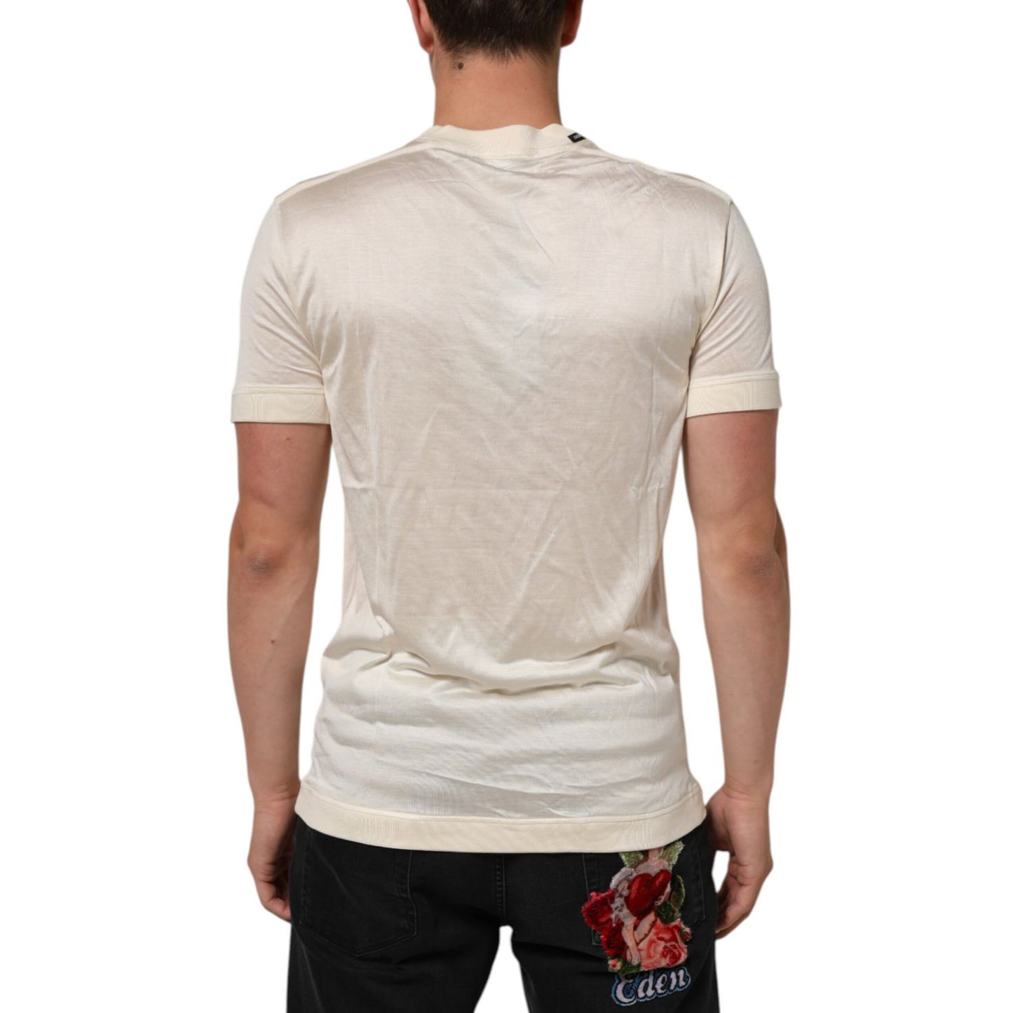 Back view of Dolce & Gabbana Off White Silk Crew Neck Short Sleeve T-shirt on model, showcasing luxury Italian craftsmanship.