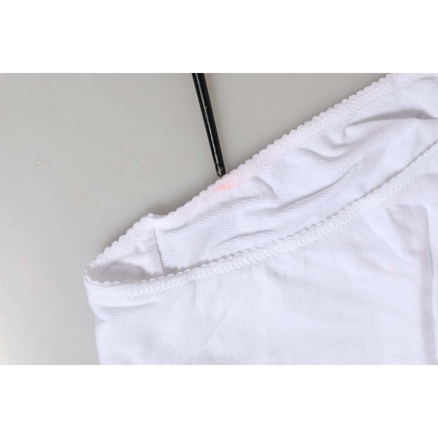 Close-up of Dolce & Gabbana White Cotton Stretch High Waist Panty Underwear, showcasing minor defects like pulled threads and makeup stains.