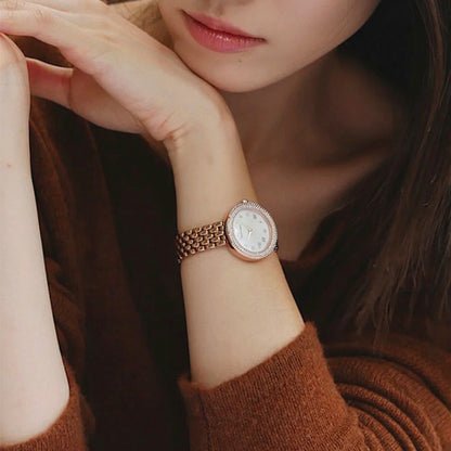 Lady wearing EMPORIO ARMANI MOD. AR11355 wristwatch in SS IP Rose Gold