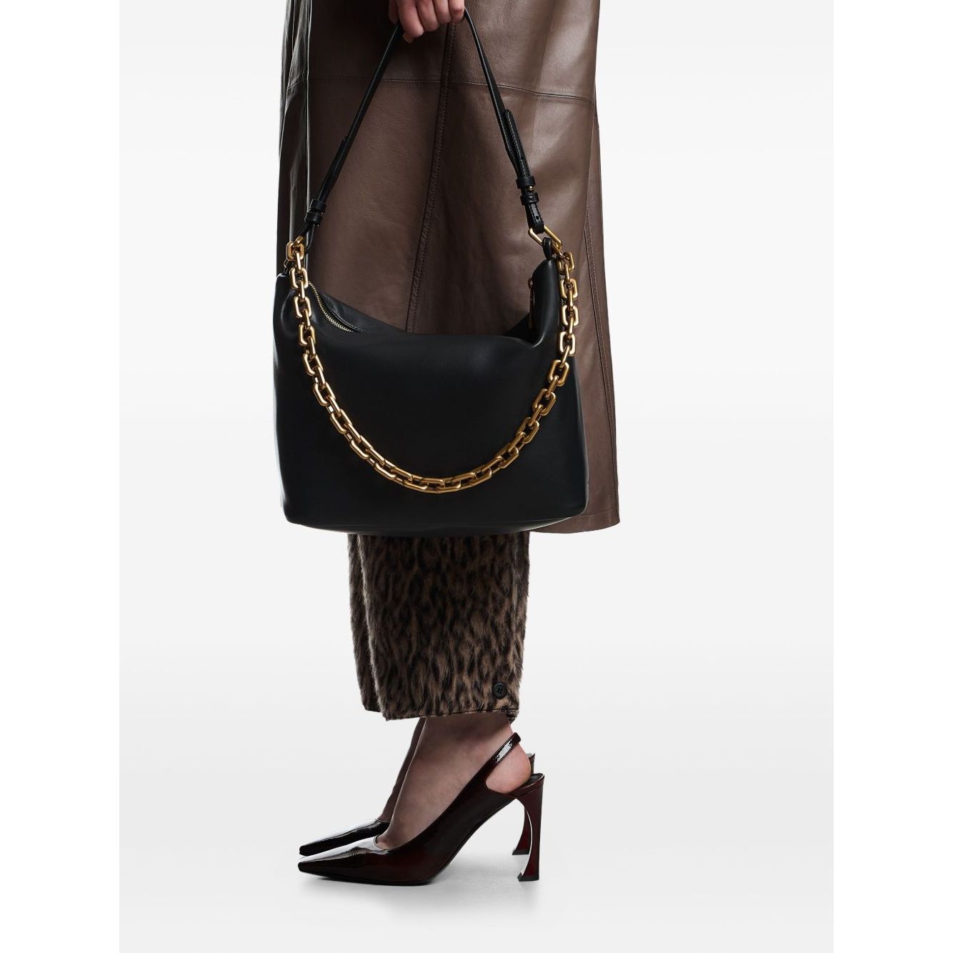 Emporio Armani Medium leather hobo bag with chain in black with gold-tone chain detail, zip fastening, and top handle.