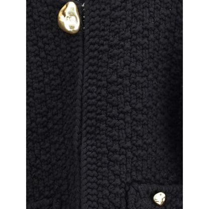Close-up of Fabiana Filippi Black Fleece Wool Coat with gold buttons and textured knit design.
