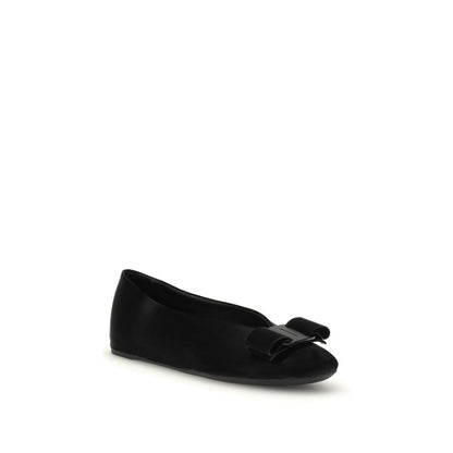 Ferragamo Black Calf Leather Bos Taurus Ballet Flats with Vara bow on a white background.