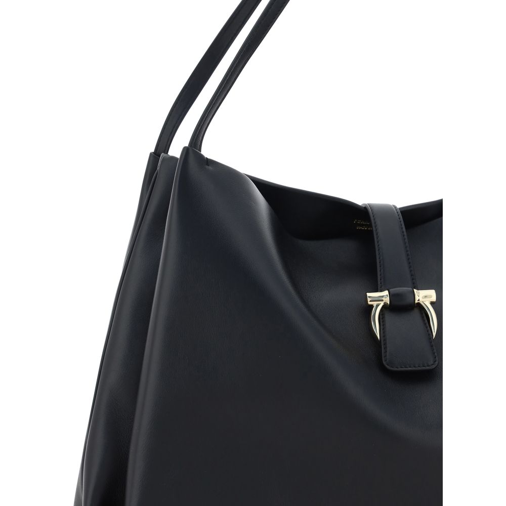 Ferragamo Black Calf Leather Bos Taurus Handbag with double flat handles and magnetic closure, featuring grained design and logo applique.