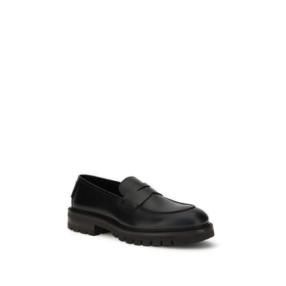 Ferragamo Black Rubber Slip-On Loafers with a contemporary design and bold rubber sole for elegance and comfort.
