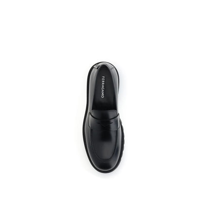 Top view of Ferragamo Black Rubber Slip-On Loafers with rounded toe and brushed calfskin, showcasing the sleek design and iconic details.
