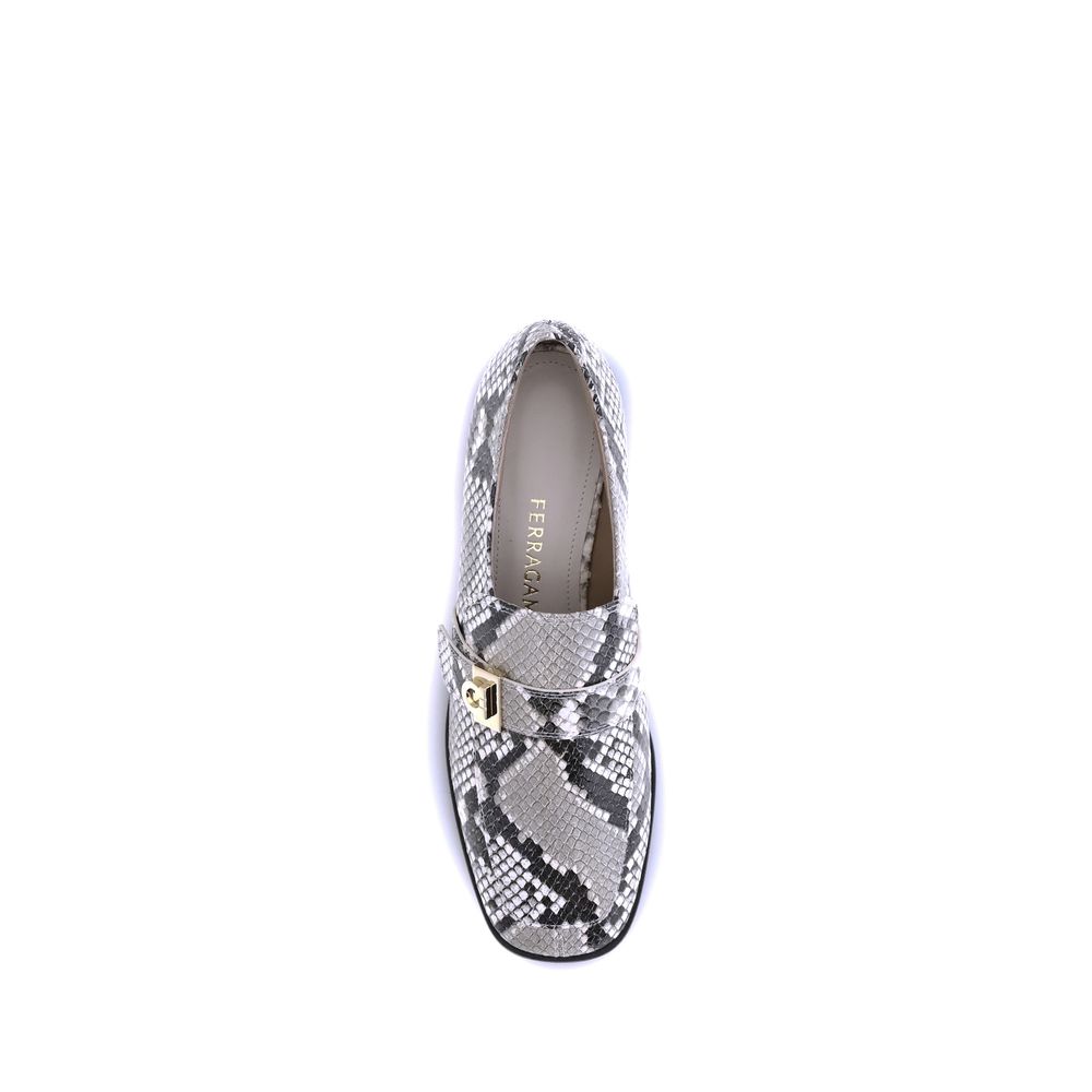 Ferragamo Multicolor Goatskin Slip-On Loafers with python print leather and golden metal detail on a white background.