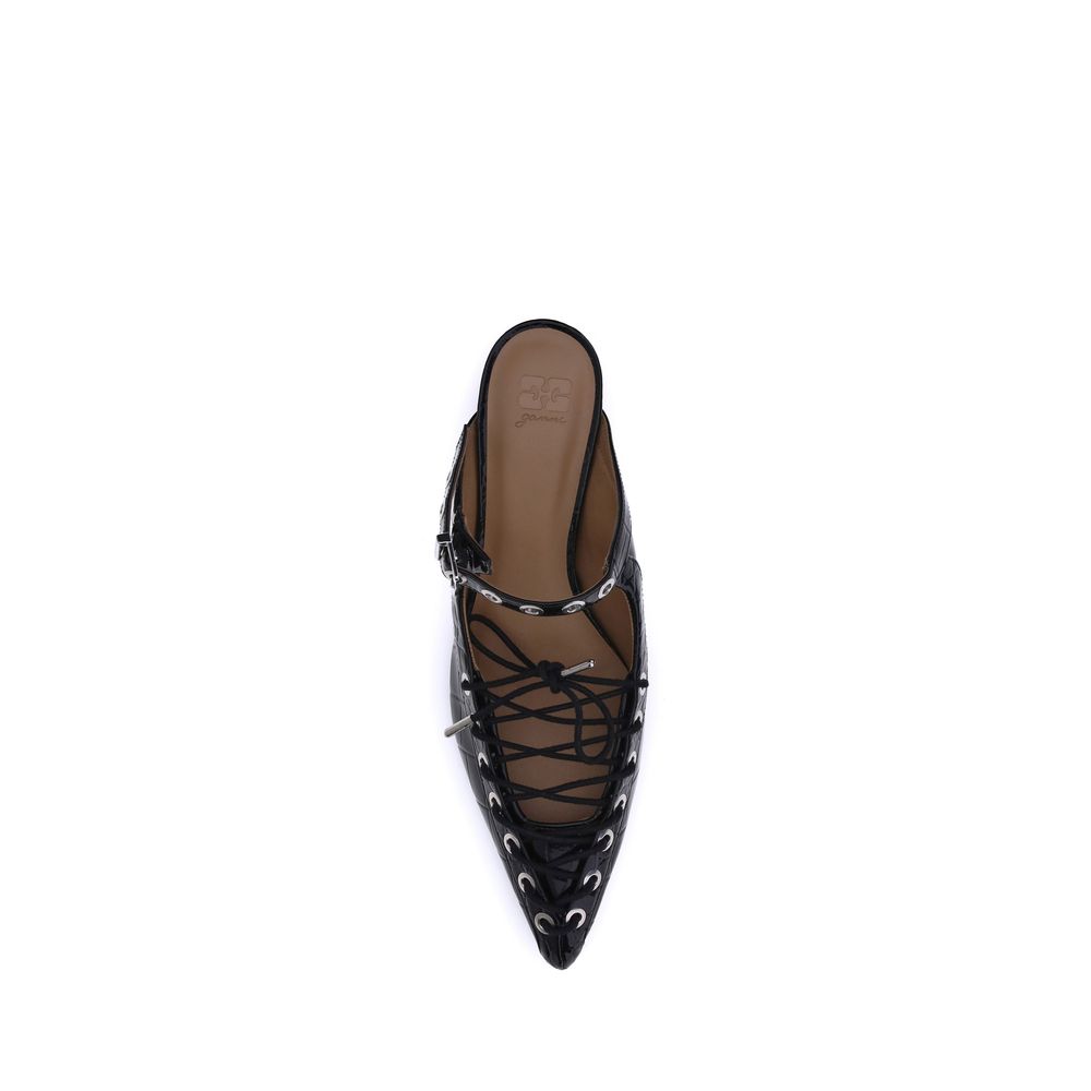 Ganni Oleatex laced Mules with tapered toe, crisscross laces, metal eyelets, and mini heel, inspired by 1920s lace-up boots.