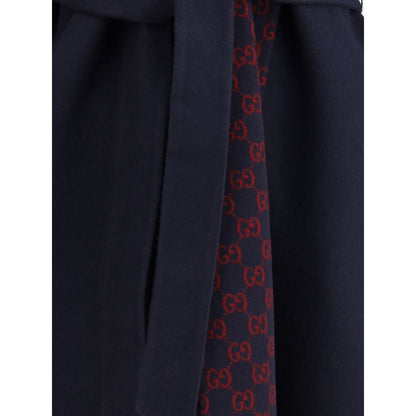 Gucci Blue Wool Coat with iconic monogram detail and removable sash, elegant and stylish design.