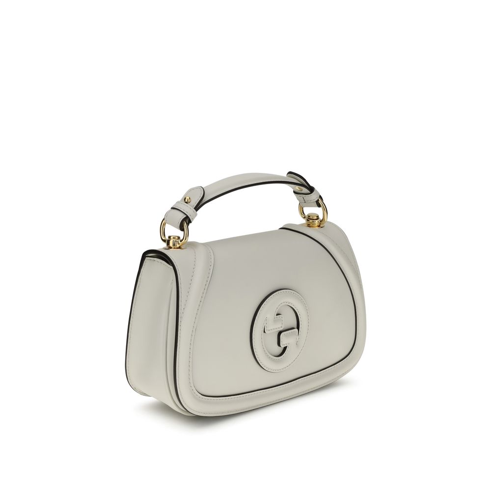 Gucci White Calf Leather Bos Taurus Handbag with tonal GG applique, flat handle, adjustable strap, magnetic closure, back pocket.
