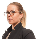 Woman wearing Longines Brown Women Glasses Frame with acetate full-rim in professional attire, highlighting rectangle style and demo lenses.
