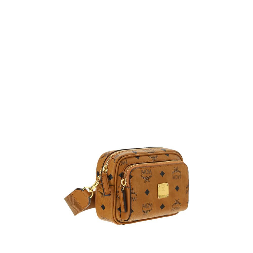 MCM Brown Cotton Shoulder Bag with iconic monogram print, gold-tone details, adjustable strap, and top zipper closure.
