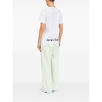 Back view of a person wearing MM6 Maison Margiela T-shirts and Polos White with a graphic print and V-neck design.