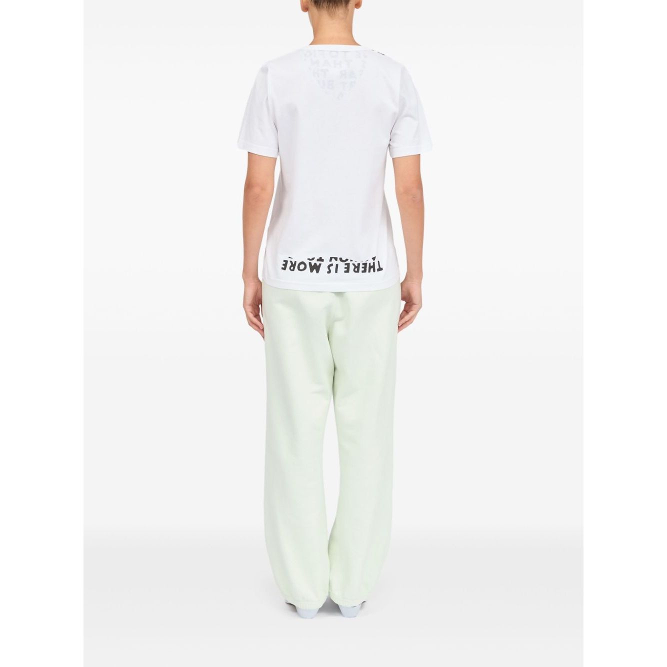 Person wearing MM6 Maison Margiela T-shirts and Polos White graphic print back view