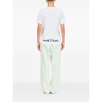 Person wearing MM6 Maison Margiela T-shirts and Polos White graphic print back view