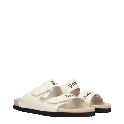 Palm Angels Beige Leather Slippers with front logo, open toe, rubber sole, and low flat heel in beige color with black accents.