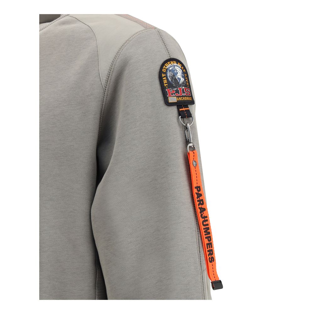 Close-up of Parajumpers Sabre Basic Sweatshirt sleeve with patch and orange tag, highlighting technical design and quality materials.