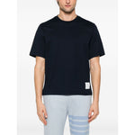 Thom Browne T-shirts and Polos Blue oversized cotton t-shirt with midnight blue color, grosgrain side tabs, and RWB stripe detailing.