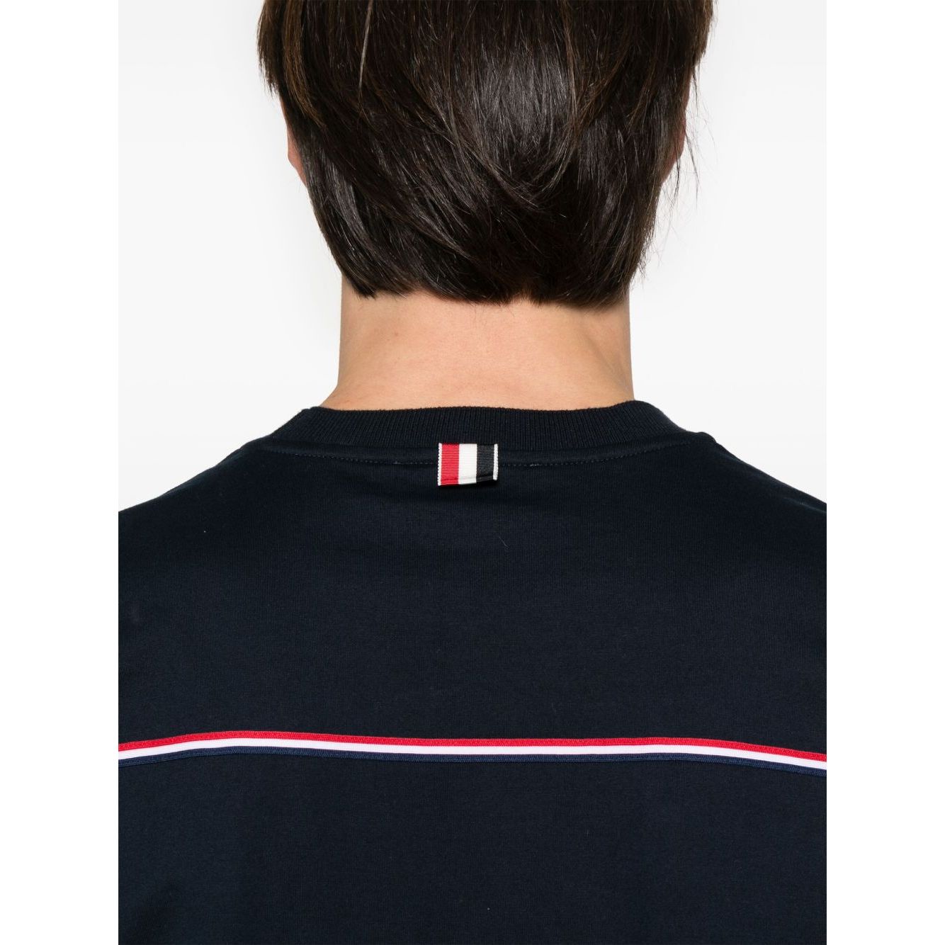 Back view of Thom Browne T-shirts and Polos Blue showcasing midnight blue with RWB stripe and signature grosgrain detailing.