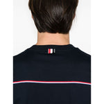 Back view of Thom Browne T-shirts and Polos Blue showcasing midnight blue with RWB stripe and signature grosgrain detailing.