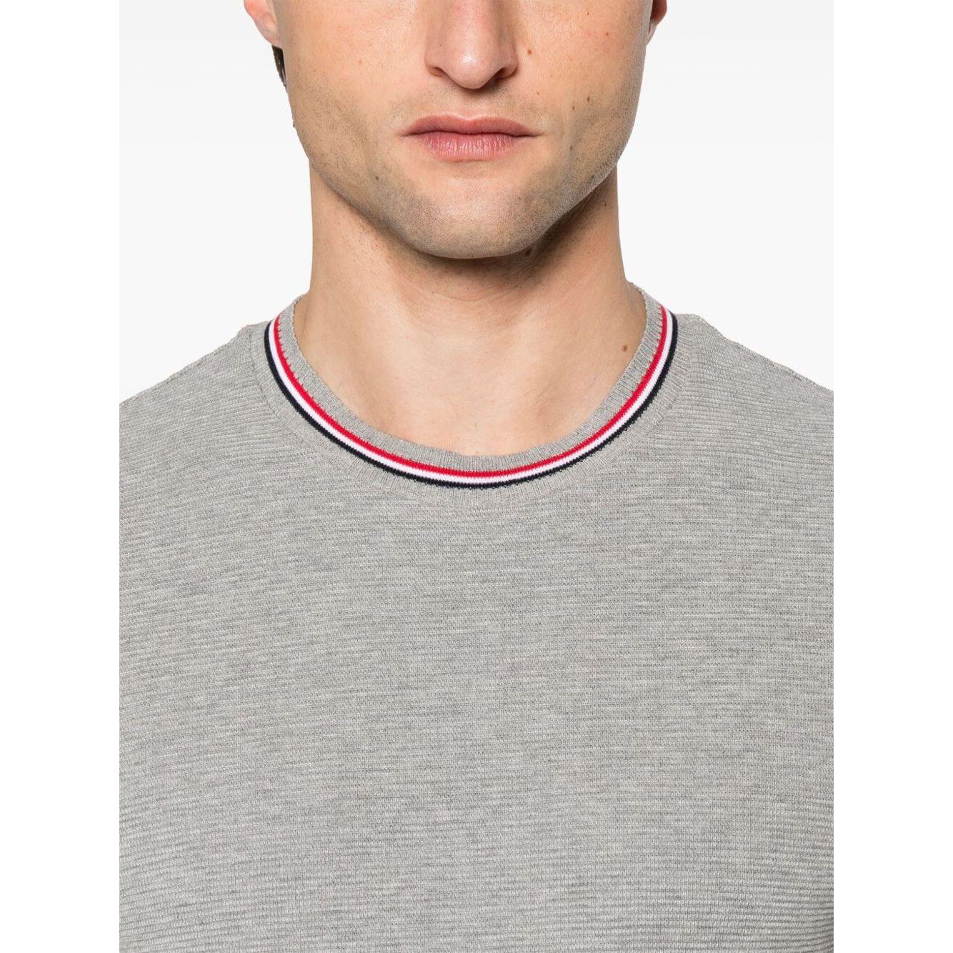 Thom Browne T-shirts and Polos Light Grey with signature grosgrain side tabs and Rwb stripe detailing, front view.