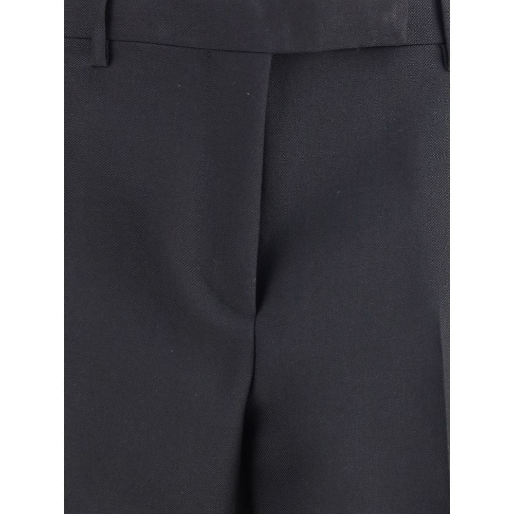 Close-up of Tom Ford Black Wool Pants featuring fine wool gabardine, high waist, belt loops, and elegant center pleat, AW25 collection.