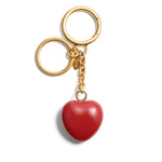 Valentino Garavani Coeur Royal key ring with red heart charm and polished gold finish, 13cm length, 3.5cm width, luxurious accessory.