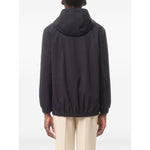 Back view of Valentino Nylon Hooded Jacket with VLogo Patch in navy blue, featuring a classic hood and elastic hem.
