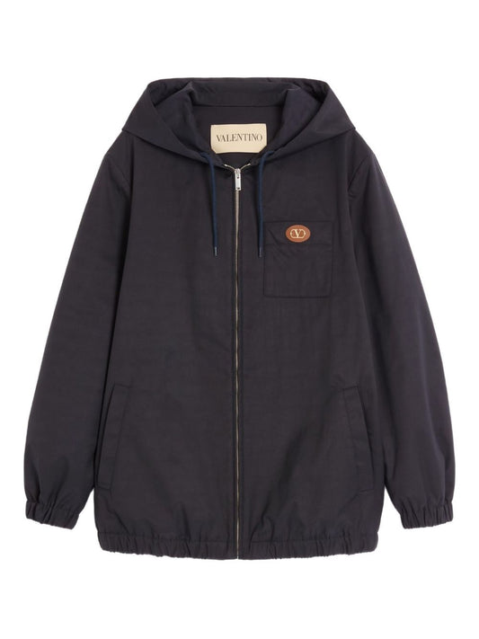 Valentino Nylon Hooded Jacket with VLogo Patch in navy with chest pocket and signature front zip, ideal for stylish comfort.