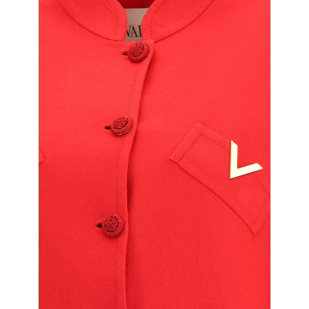 Valentino Red Fleece Wool Coat with soutache buttons and VLogo on welt pocket, showcasing elegant details of the compact drap fabric.